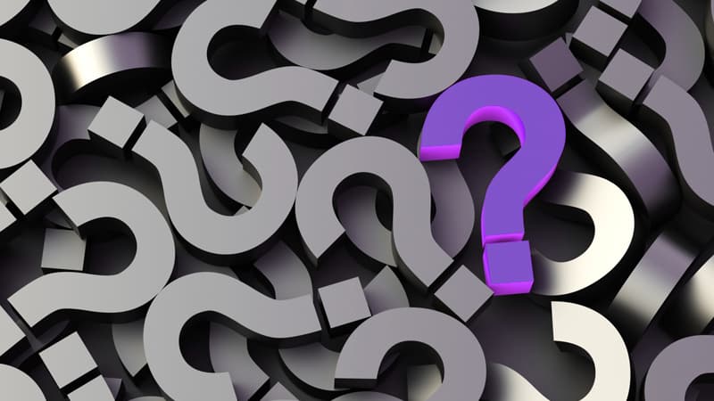 Illustration of a pile of question marks, with one standing out in colour